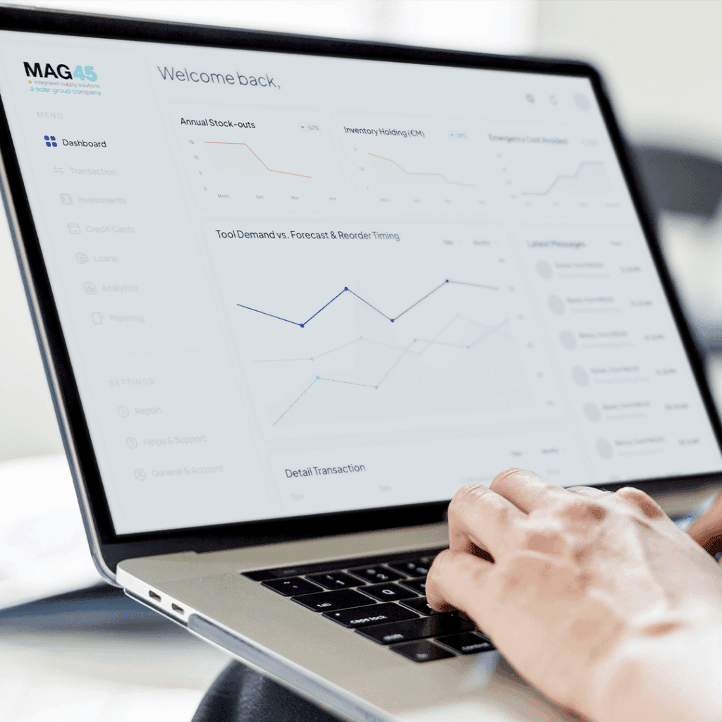 Person typing on laptop showing dashboard with interface for demand forecasting and reorder timing